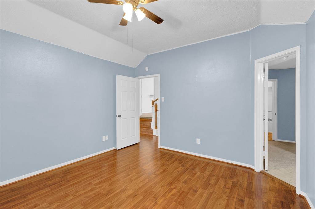 3714 Cedar Glen Lane Spring, TX 77388 - Photo 11 of 29 Unfurnished bedroom featuring vaulted ceiling, wood finished floors, and ceiling fan