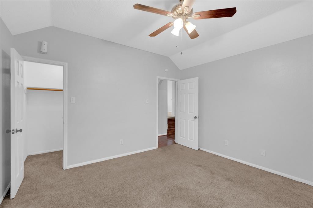 3714 Cedar Glen Lane Spring, TX 77388 - Photo 18 of 29 Unfurnished bedroom with a walk in closet, light colored carpet, and ceiling fan