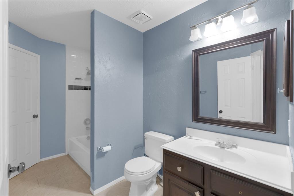 3714 Cedar Glen Lane Spring, TX 77388 - Photo 25 of 29 Full bathroom featuring vanity, tub / shower combination, and light tile patterned flooring