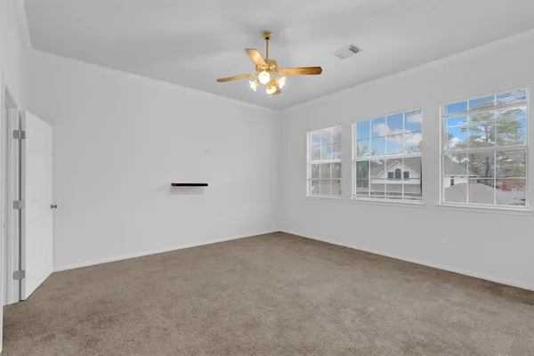 a view of an empty room with a window