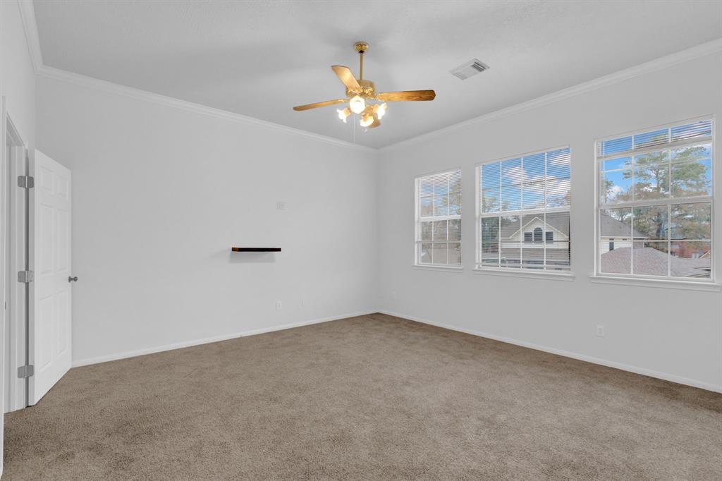 3714 Cedar Glen Lane Spring, TX 77388 - Photo 27 of 29 Empty room with light carpet, crown molding, and ceiling fan