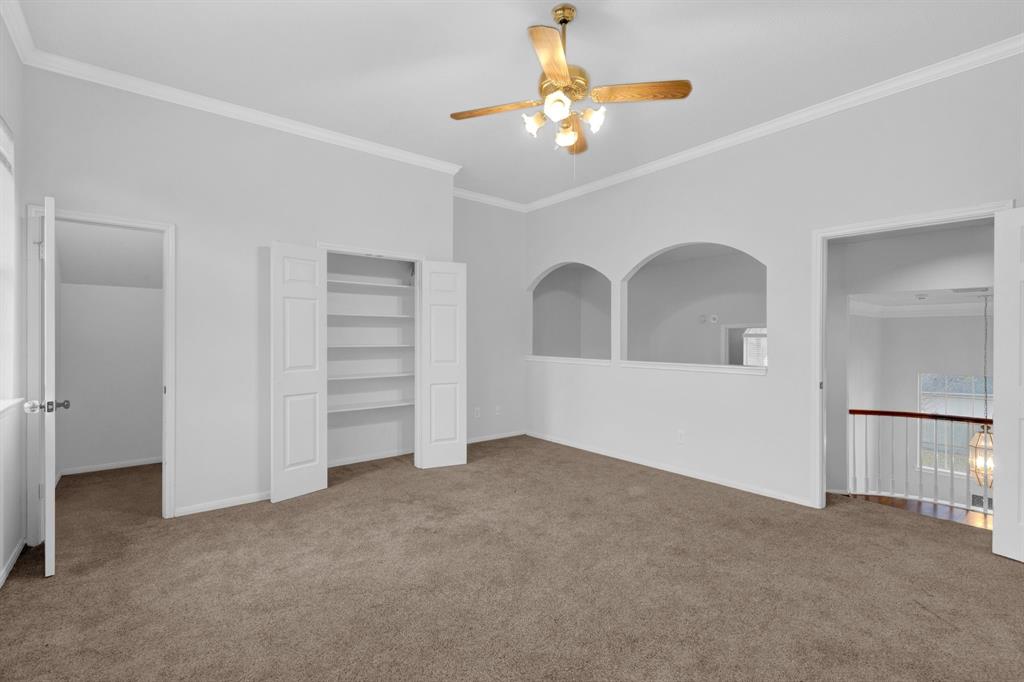 3714 Cedar Glen Lane Spring, TX 77388 - Photo 28 of 29 Unfurnished bedroom with ornamental molding, carpet flooring, ceiling fan, and a closet