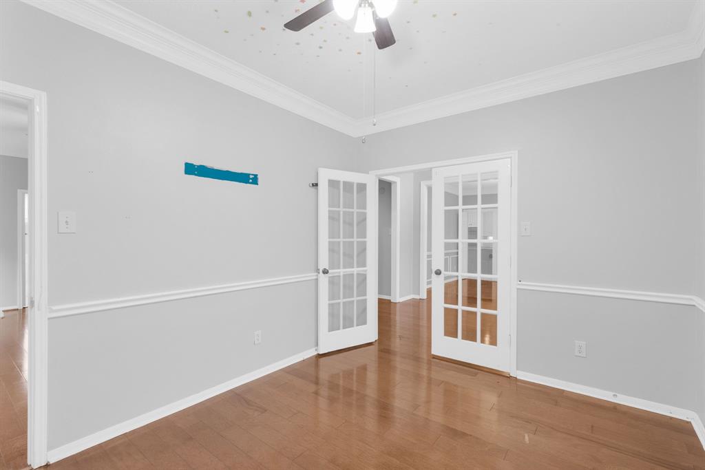 3714 Cedar Glen Lane Spring, TX 77388 - Photo 5 of 29 Spare room featuring french doors, ornamental molding, wood finished floors, and a ceiling fan