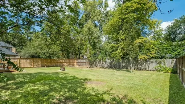 a view of outdoor space with deck and yard