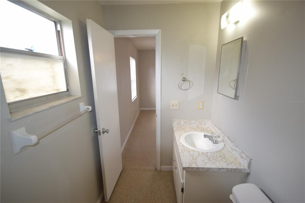115 Leelon Road, Unit 115 Lakeland, FL 33809 - Photo 2 of 14 a bathroom with a sink and toilet