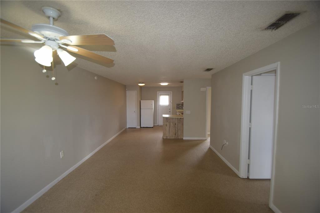 115 Leelon Road, Unit 115 Lakeland, FL 33809 - Photo 6 of 14 a view of a livingroom and a chandelier