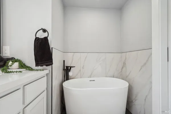 a white toilet sitting next to a bathroom sink