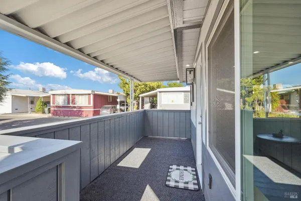 a view of a porch with furniture