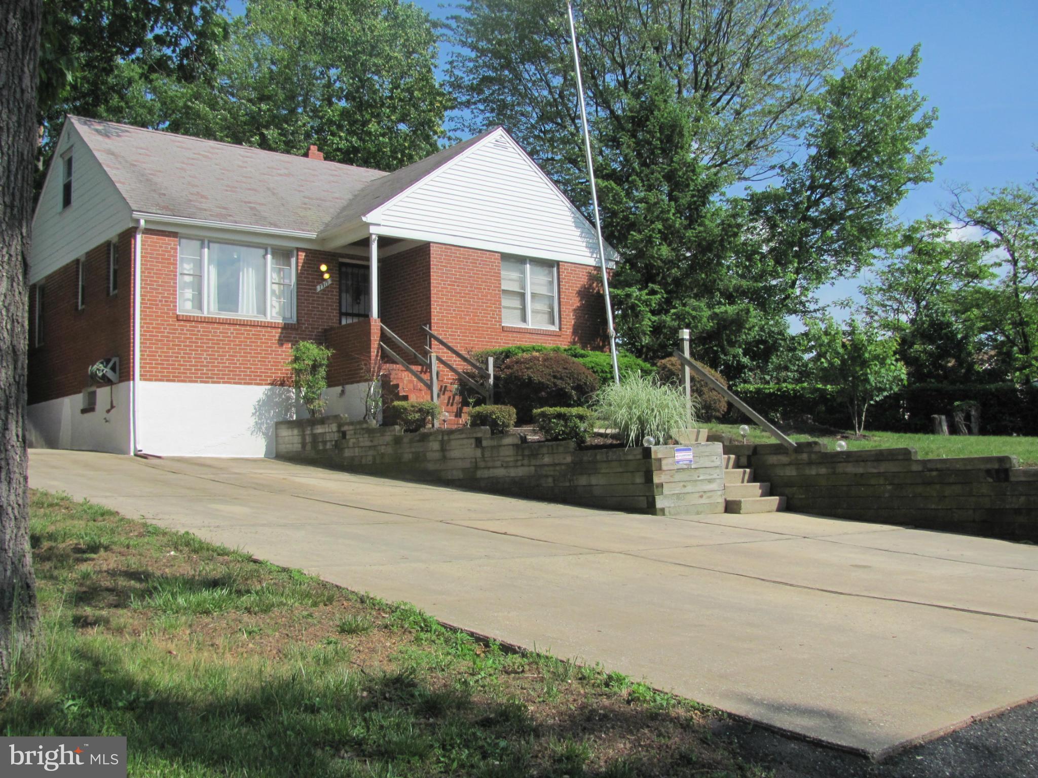 7919 Hillendale Road Baltimore, MD 21234 - Photo 1 of 29 a front view of a house with yard and green space