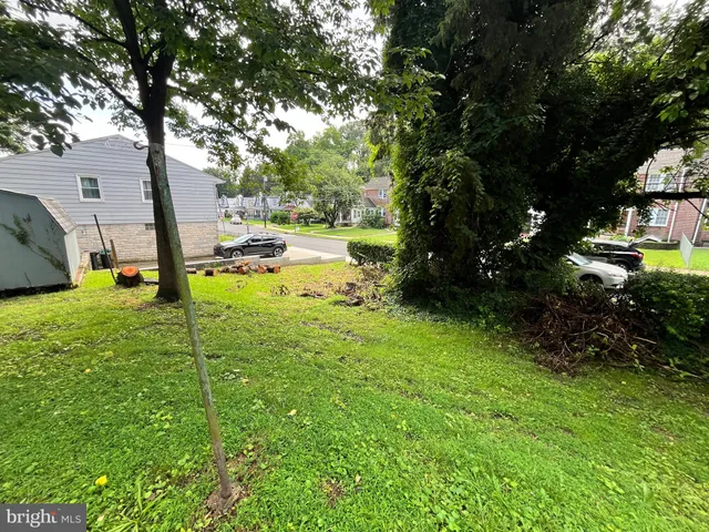 a view of a backyard with swimming pool