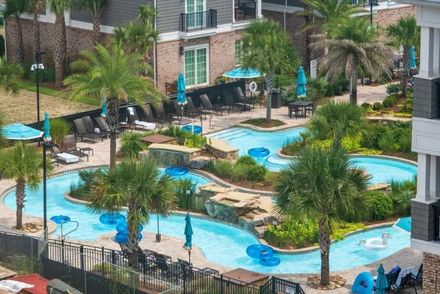 a view of a swimming pool with a patio