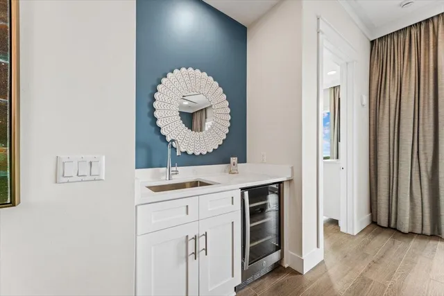 a room with a mirror and a sink