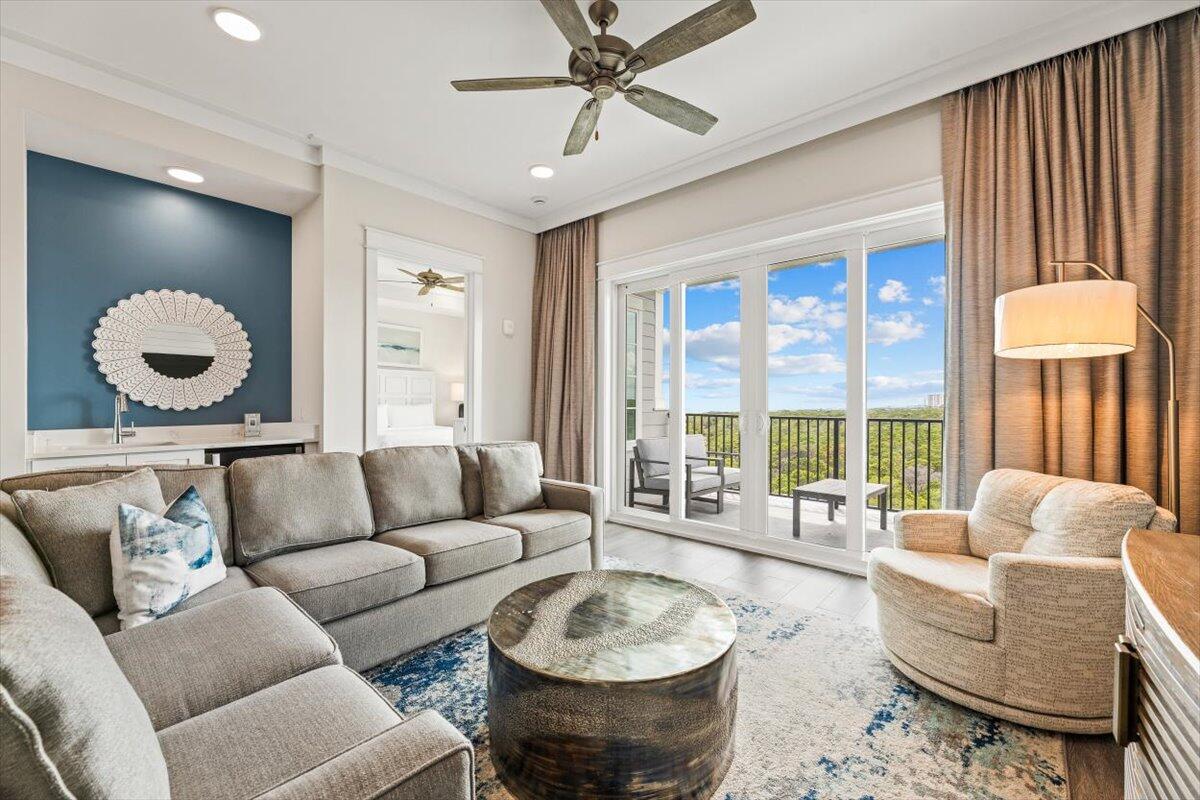 206 Henderson Resort Way, Unit 5403 Destin, FL 32541 - Photo 12 of 41 a living room with furniture and a large window