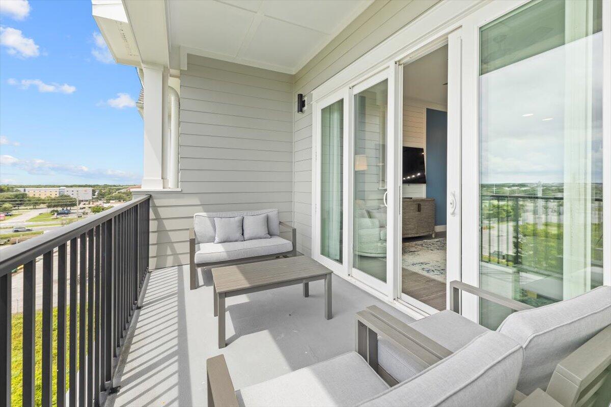 206 Henderson Resort Way, Unit 5403 Destin, FL 32541 - Photo 14 of 41 a balcony with furniture and next to a window