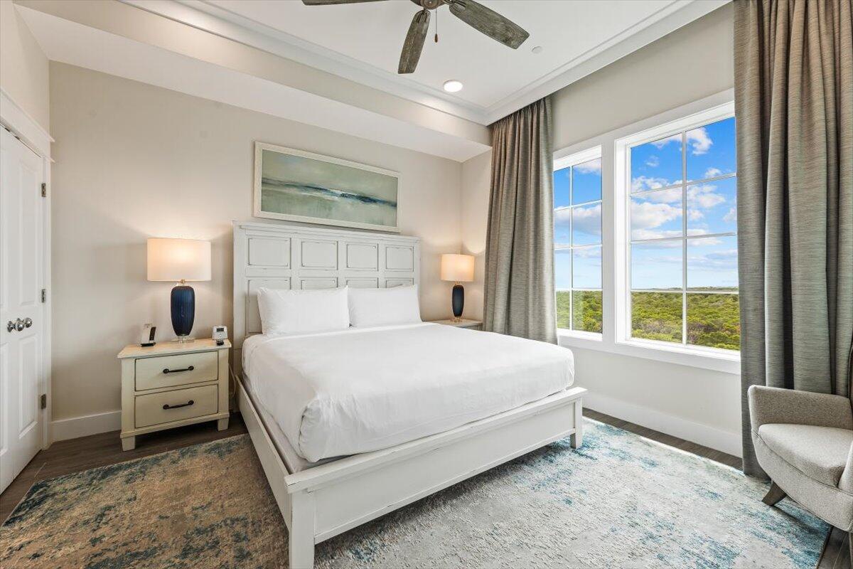 206 Henderson Resort Way, Unit 5403 Destin, FL 32541 - Photo 16 of 41 a bed sitting in a bedroom next to a window