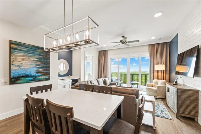 a large kitchen with a table and chairs