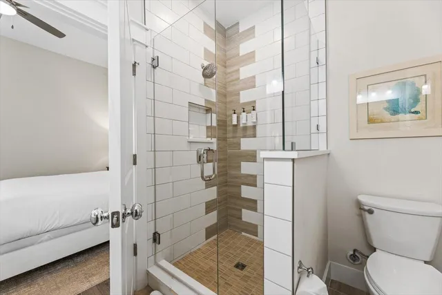 a bathroom with a shower and a toilet
