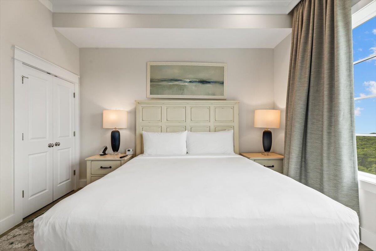 206 Henderson Resort Way, Unit 5403 Destin, FL 32541 - Photo 26 of 41 a bedroom with a large bed and a large window