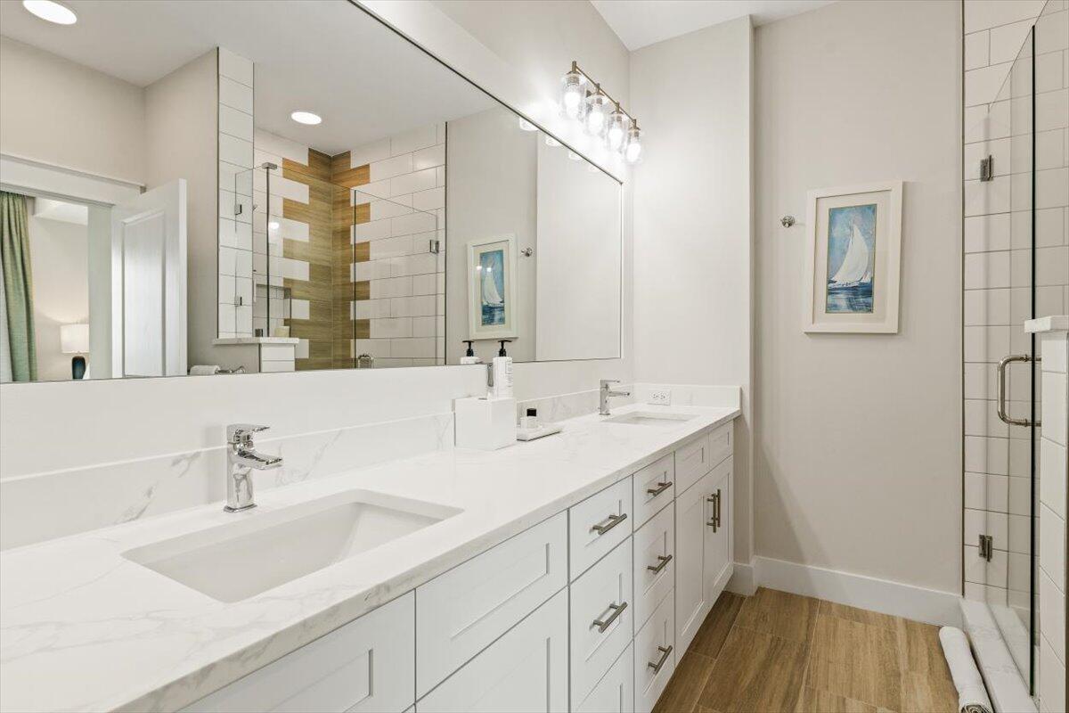 206 Henderson Resort Way, Unit 5403 Destin, FL 32541 - Photo 29 of 41 a bathroom with a double vanity sink and a mirror