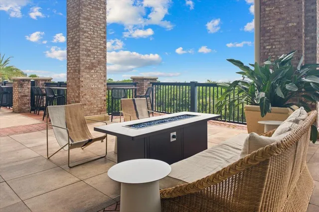 swimming pool view with a seating space