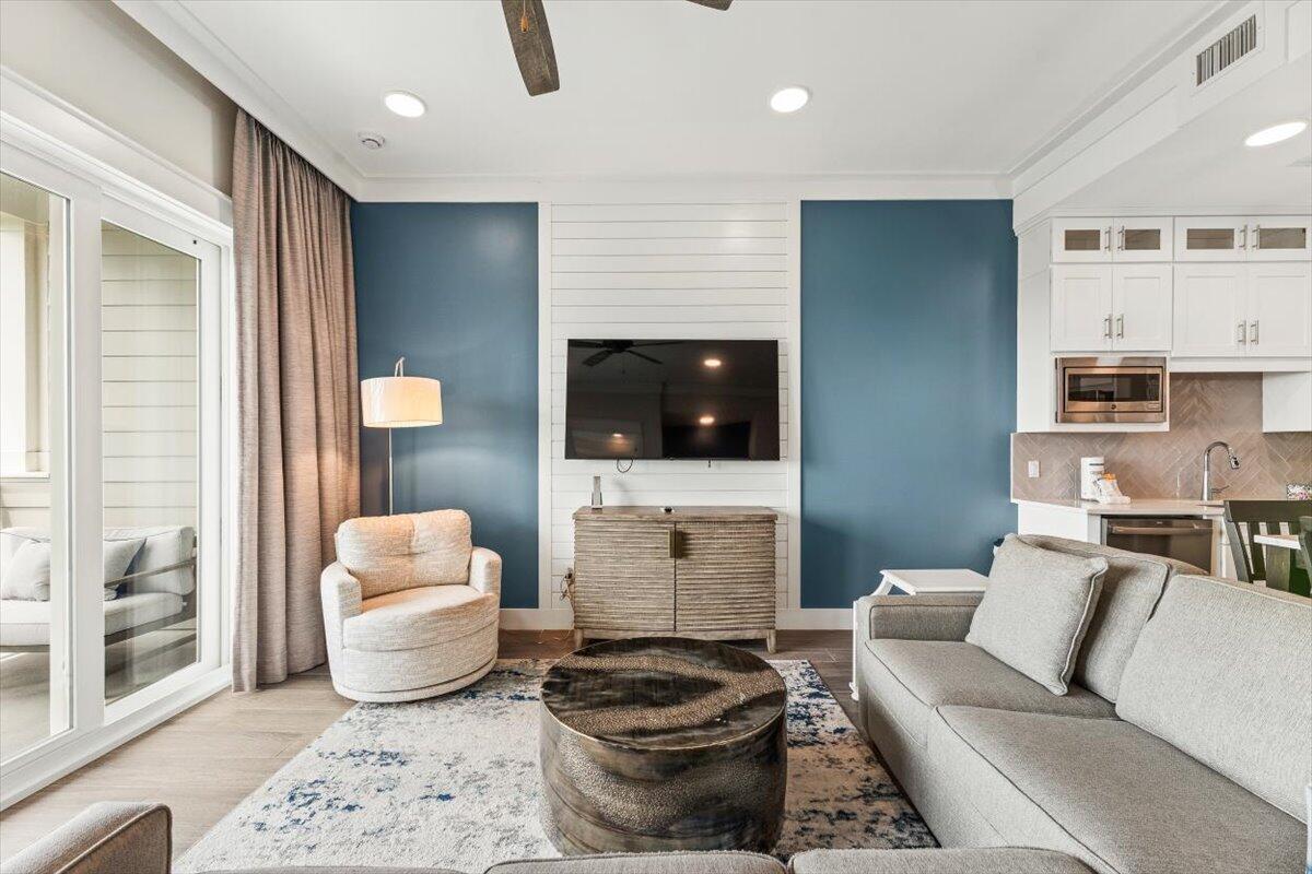 206 Henderson Resort Way, Unit 5403 Destin, FL 32541 - Photo 7 of 41 a living room with furniture and a flat screen tv