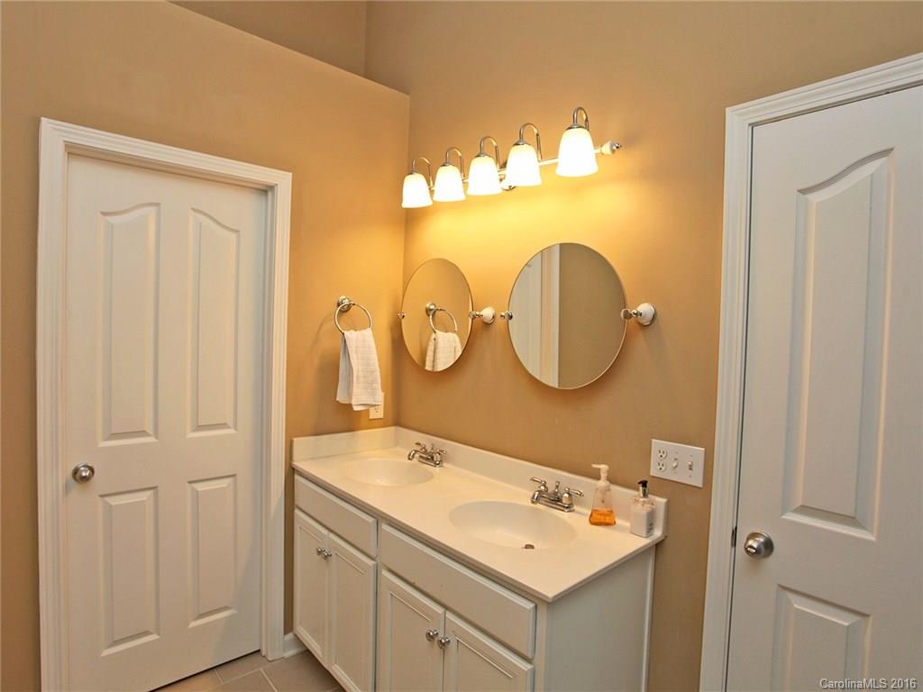1050 Market Street, Unit 1050 Fort Mill, SC 29708 - Photo 15 of 20 a bathroom with a sink and a mirror