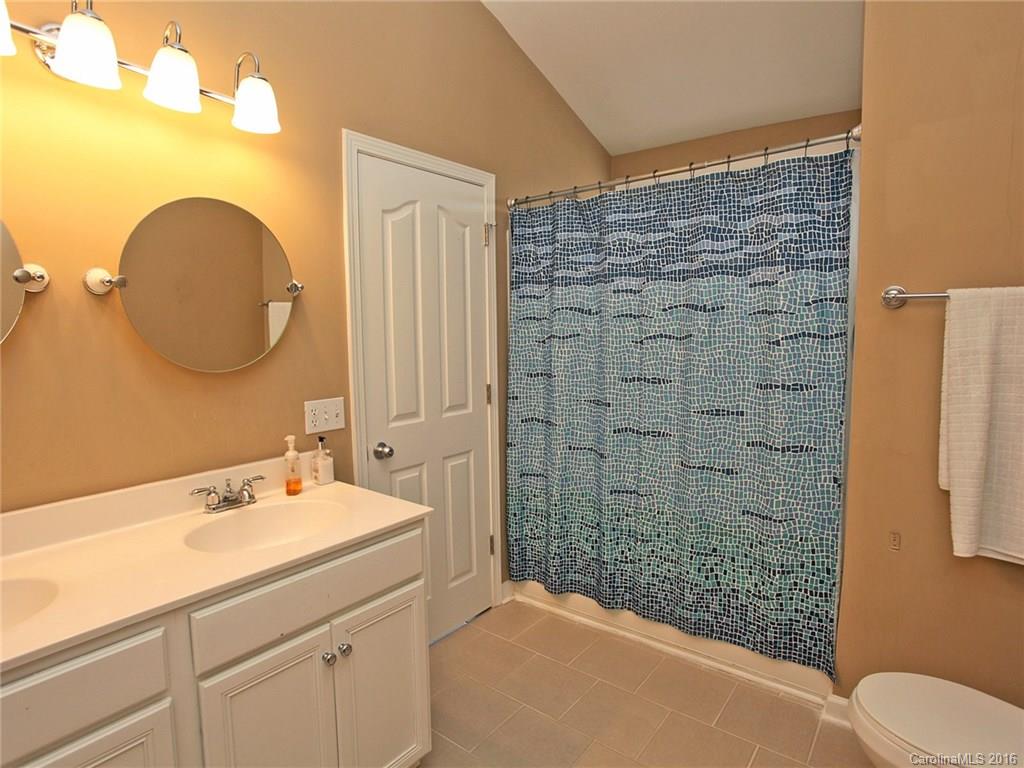 1050 Market Street, Unit 1050 Fort Mill, SC 29708 - Photo 16 of 20 a bathroom with a sink a toilet and shower