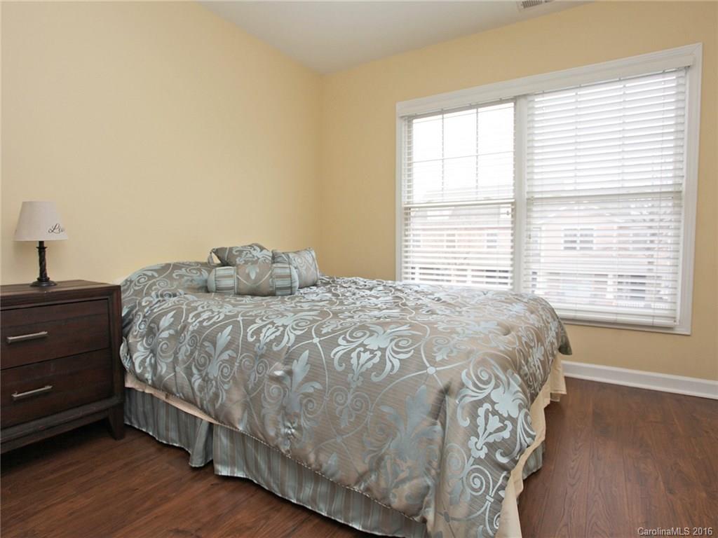 1050 Market Street, Unit 1050 Fort Mill, SC 29708 - Photo 17 of 20 a large bed sitting in a bedroom next to a window