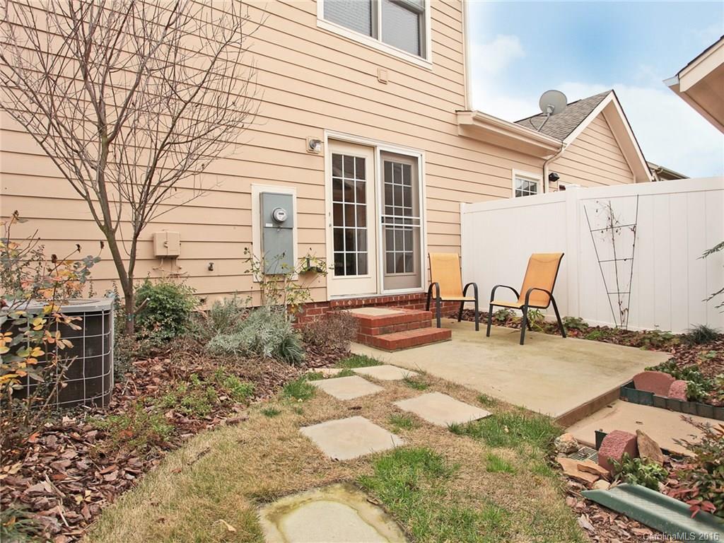 1050 Market Street, Unit 1050 Fort Mill, SC 29708 - Photo 20 of 20 a view of a dinning table and chairs in backyard of the house