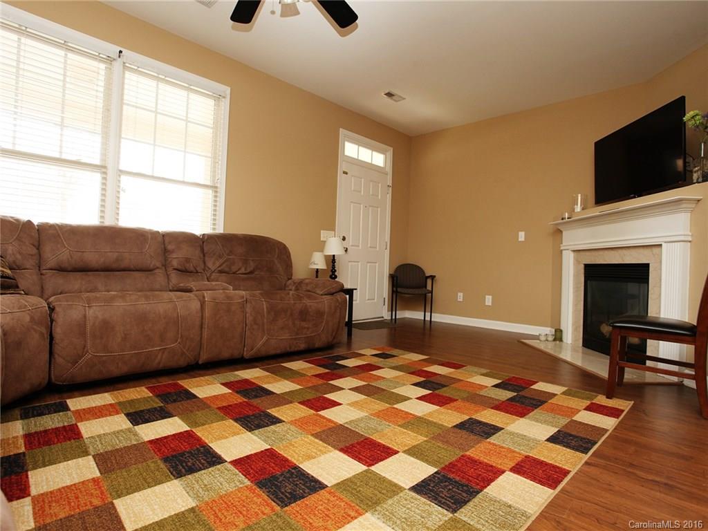 1050 Market Street, Unit 1050 Fort Mill, SC 29708 - Photo 6 of 20 a living room with a flat screen tv and a rug