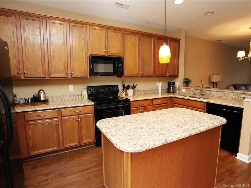 1050 Market Street, Unit 1050 Fort Mill, SC 29708 - Photo 10 of 20 a kitchen with stainless steel appliances granite countertop a sink stove and refrigerator