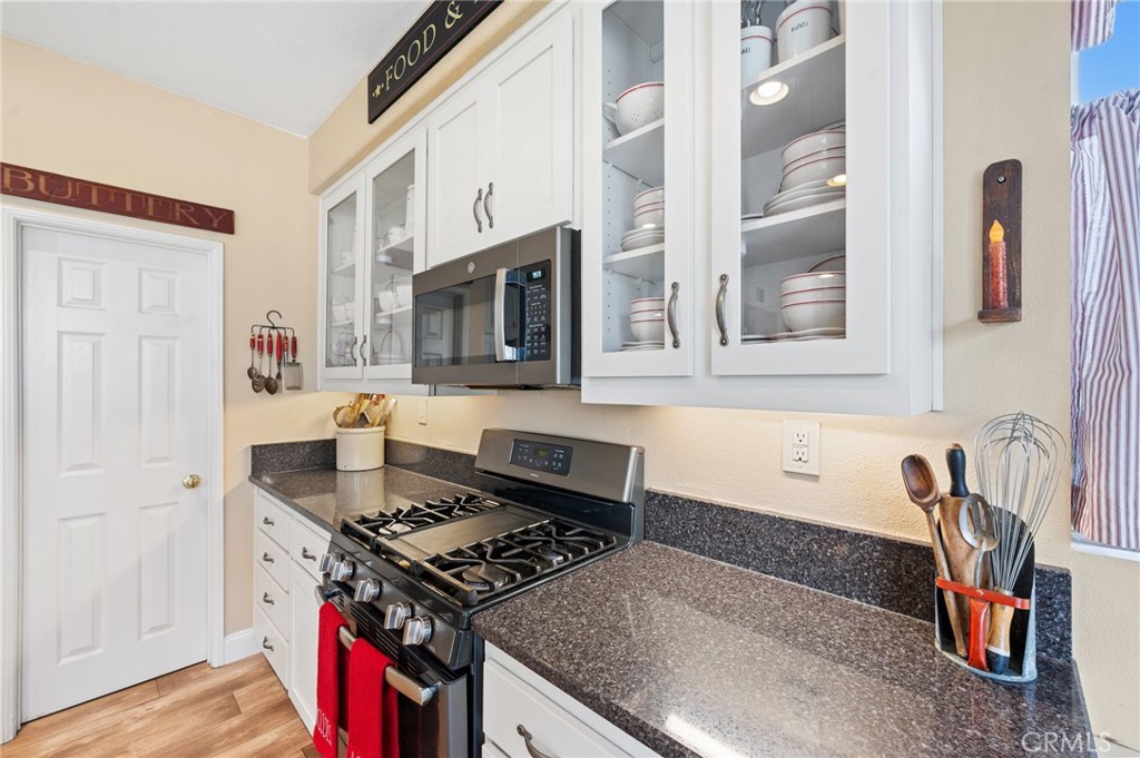 19714 Rotterdam Street Riverside, CA 92508 - Photo 14 of 46 a kitchen with stainless steel appliances granite countertop a stove and a sink