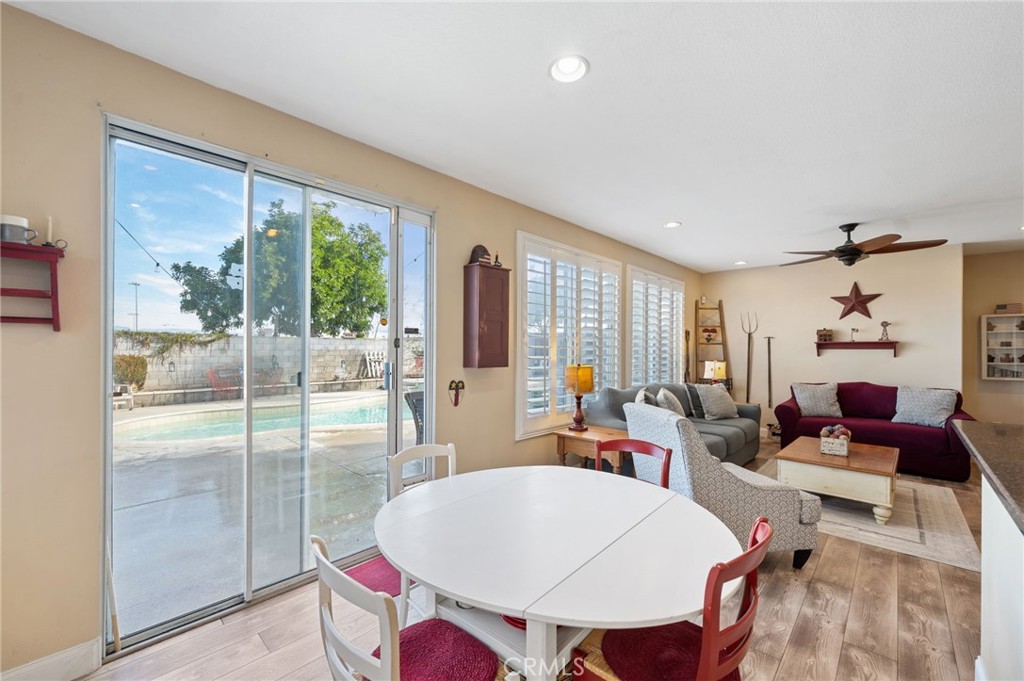 19714 Rotterdam Street Riverside, CA 92508 - Photo 16 of 46 a living room with furniture a flat screen tv and a large window