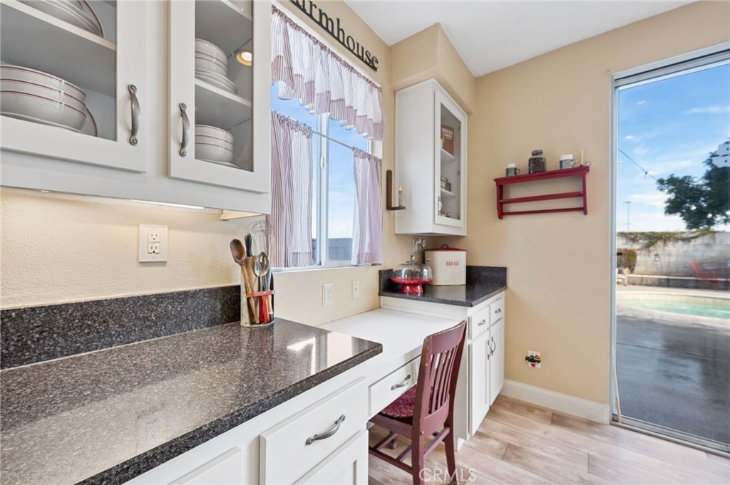 19714 Rotterdam Street Riverside, CA 92508 - Photo 17 of 46 a kitchen with stainless steel appliances granite countertop a sink and a refrigerator