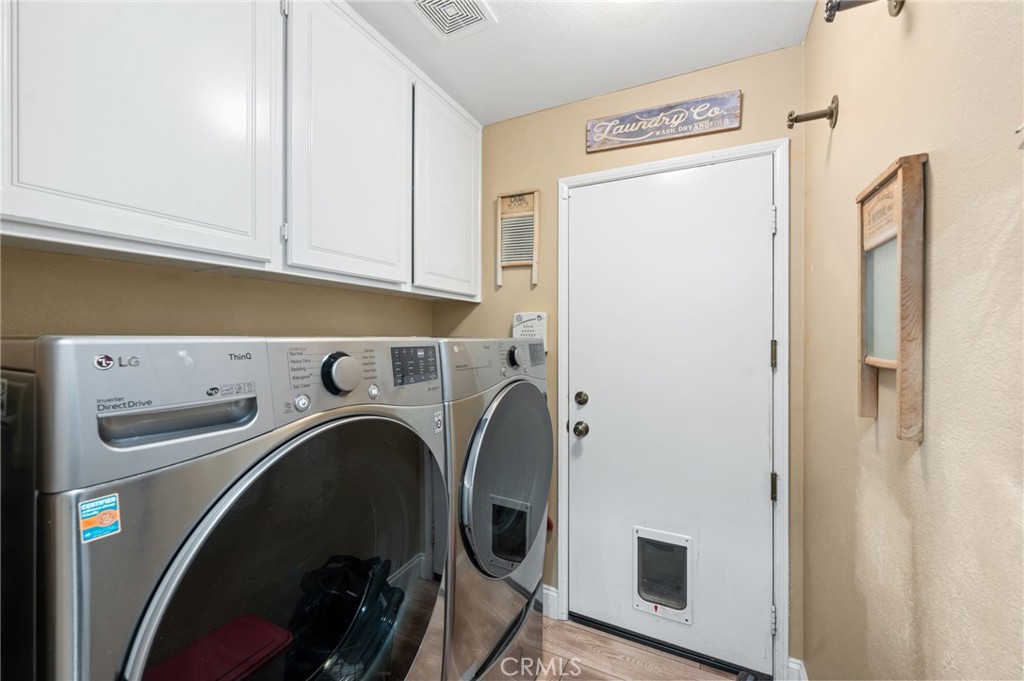 19714 Rotterdam Street Riverside, CA 92508 - Photo 18 of 46 a utility room with dryer and washer