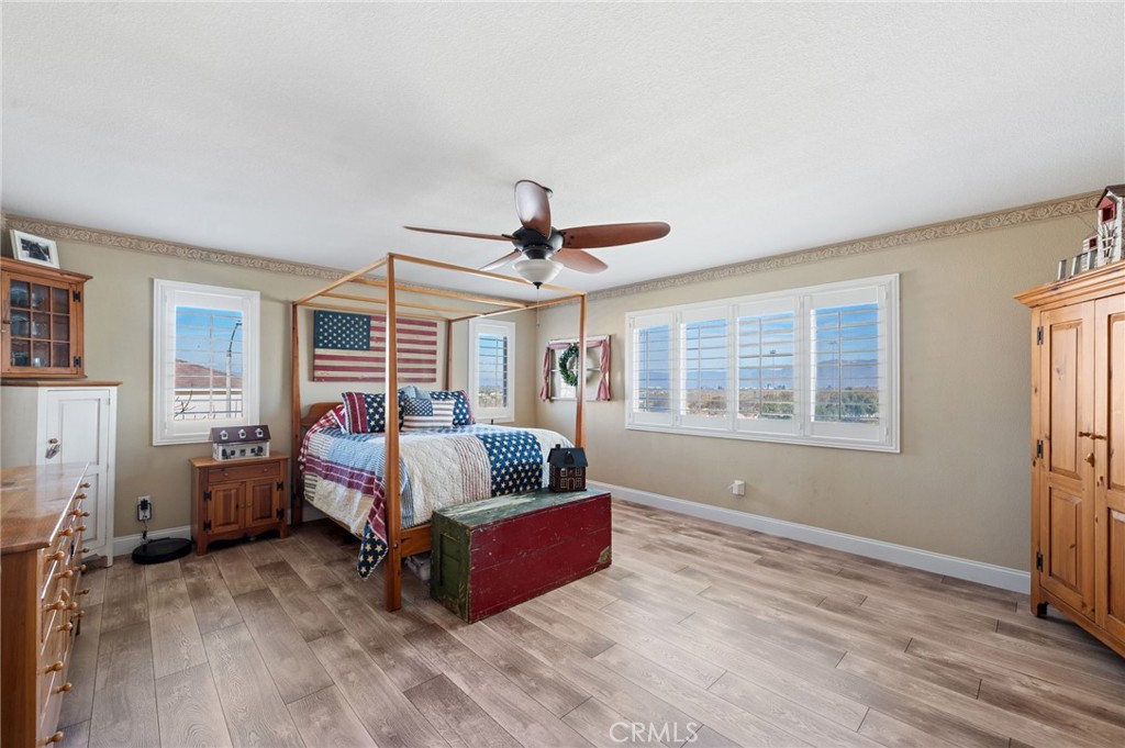 19714 Rotterdam Street Riverside, CA 92508 - Photo 22 of 46 a living room with furniture and a flat screen tv