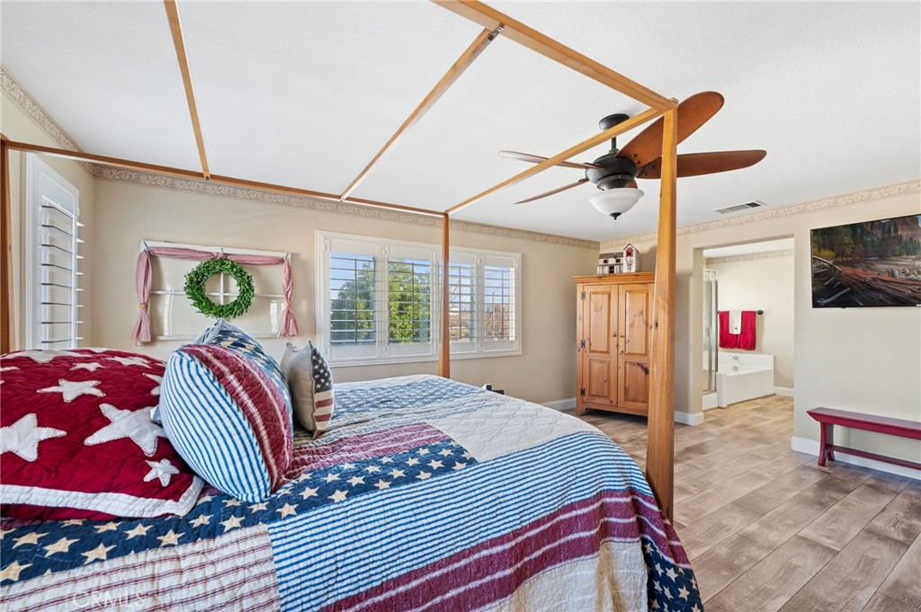 19714 Rotterdam Street Riverside, CA 92508 - Photo 23 of 46 a bedroom with a bed and a window