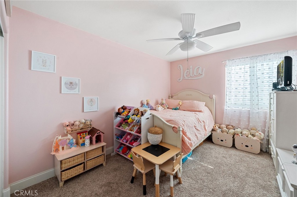 19714 Rotterdam Street Riverside, CA 92508 - Photo 34 of 46 a bedroom with a bed and a window