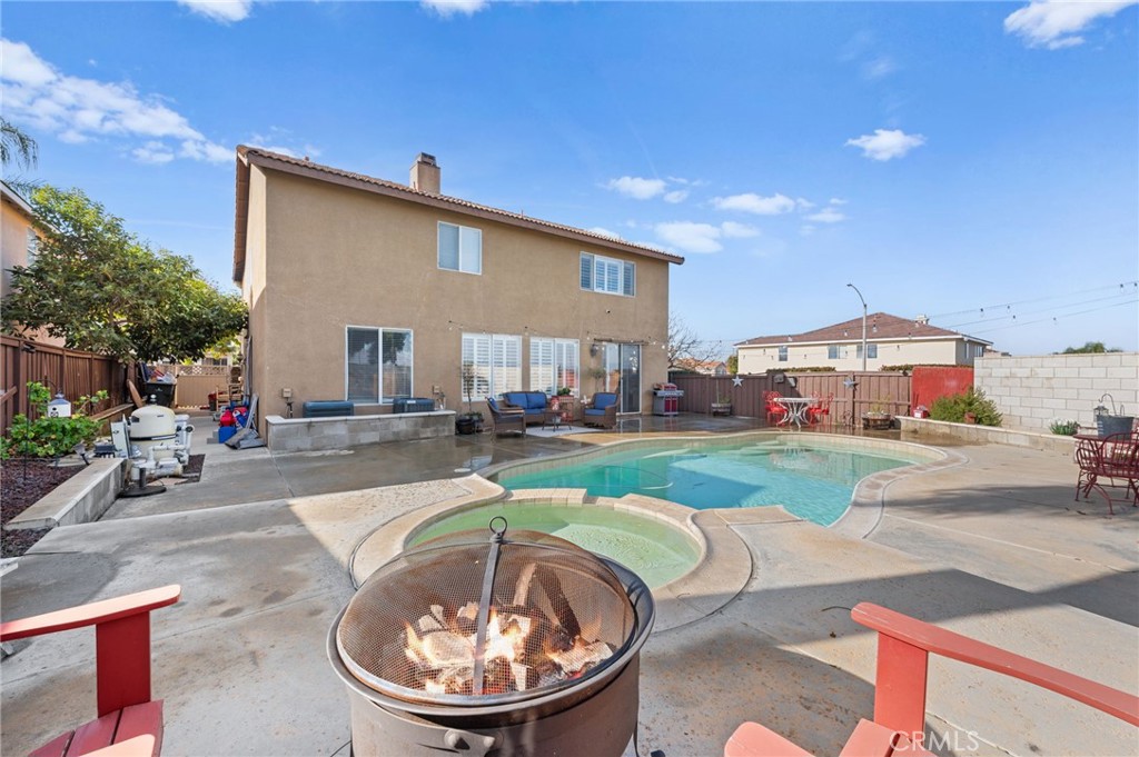 19714 Rotterdam Street Riverside, CA 92508 - Photo 37 of 46 a view of a house with a swimming pool