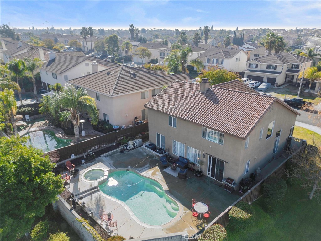 19714 Rotterdam Street Riverside, CA 92508 - Photo 44 of 46 an aerial view of houses with a swimming pool