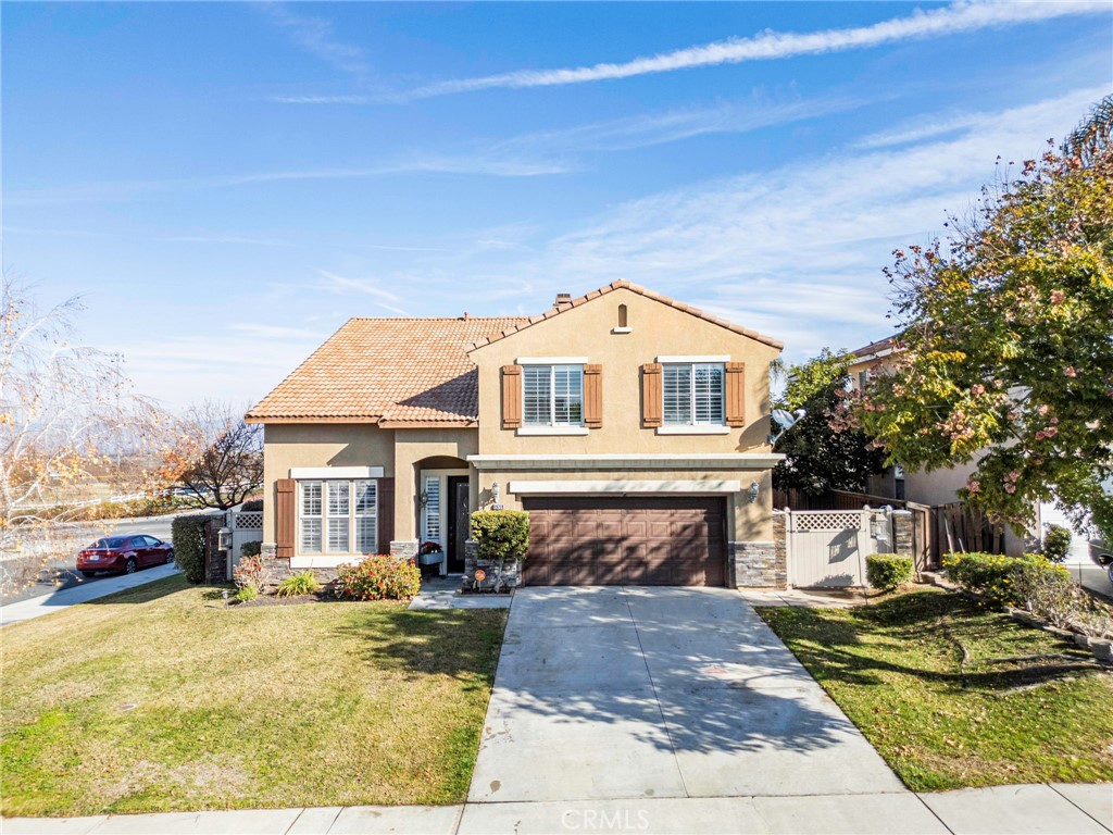 19714 Rotterdam Street Riverside, CA 92508 - Photo 46 of 46 a front view of a house with a yard