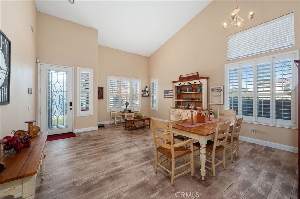 19714 Rotterdam Street Riverside, CA 92508 - Photo 7 of 46 a view of a dining room with furniture and wooden floor