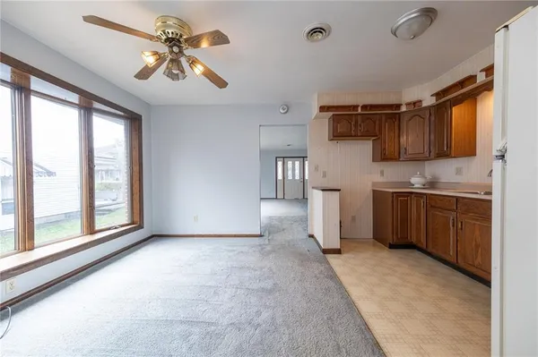 a view of a kitchen with a sink and a window