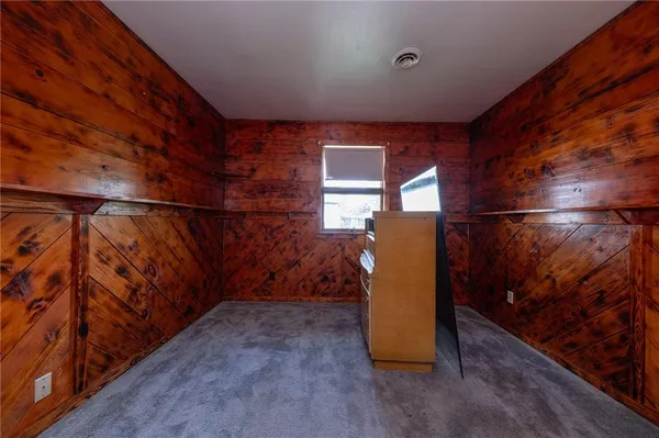an empty room with a empty space and windows