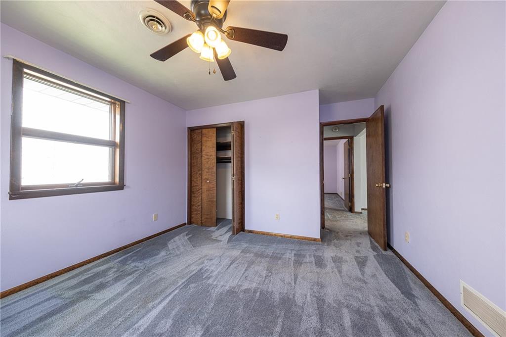 221-227 Spring Street Harwick, PA 15049 - Photo 21 of 49 a view of empty room with wooden floor and fan