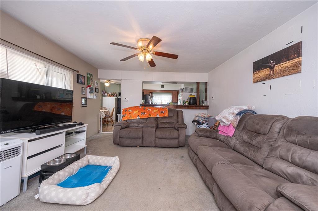 221-227 Spring Street Harwick, PA 15049 - Photo 23 of 49 a living room with furniture and a flat screen tv