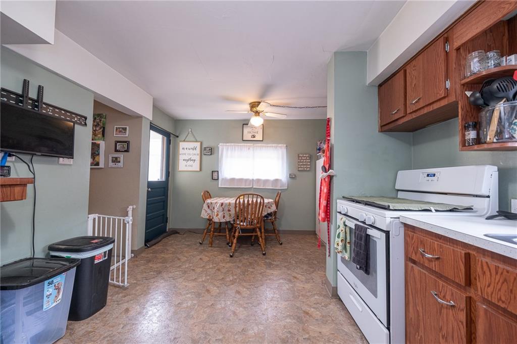 221-227 Spring Street Harwick, PA 15049 - Photo 26 of 49 a view of a kitchen with fridge and wooden floor