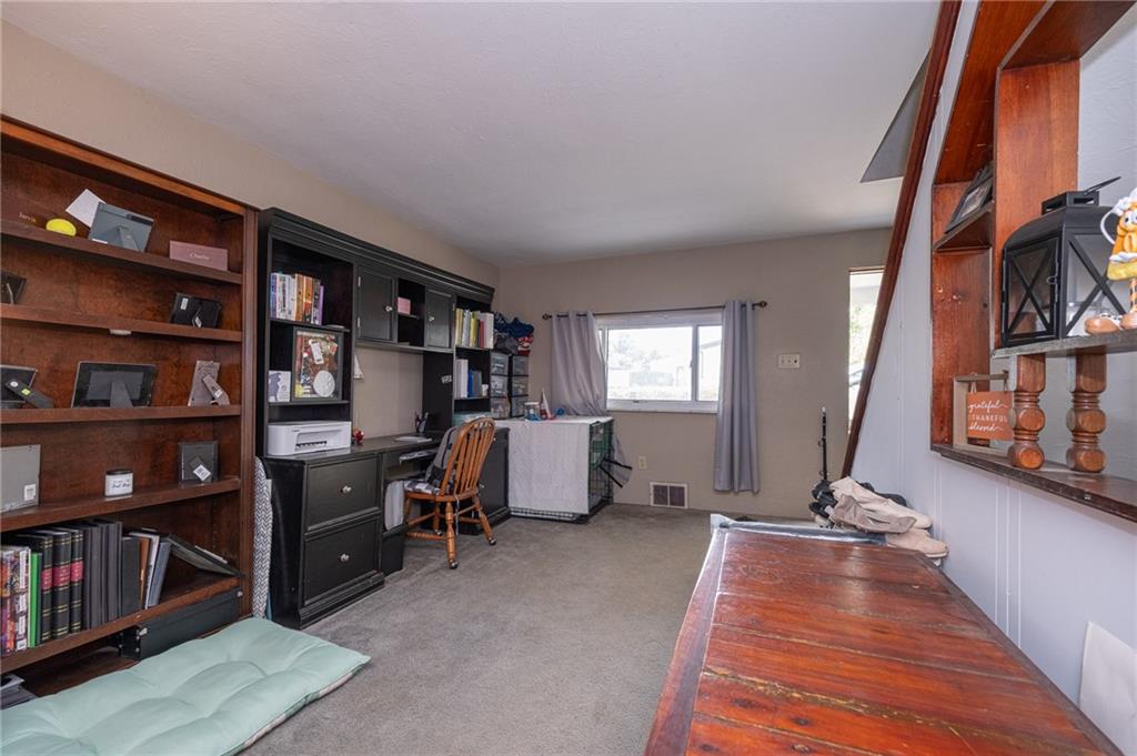 221-227 Spring Street Harwick, PA 15049 - Photo 27 of 49 a view of living room with furniture and book shelf
