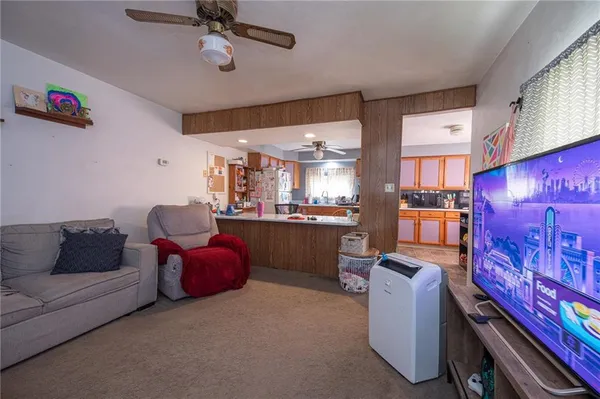 a large kitchen with lots of table and chairs