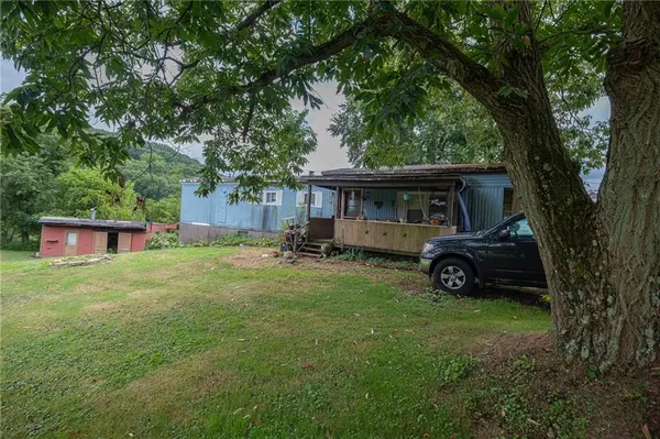 a view of a house with a back yard
